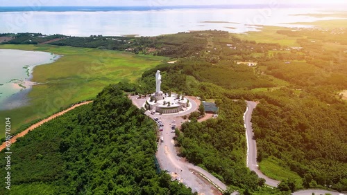 Aerial view of Our lady of Lourdes Virgin Mary catholic religious statue on a Nui Cui mountain in Dong Nai province, Vietnam. photo