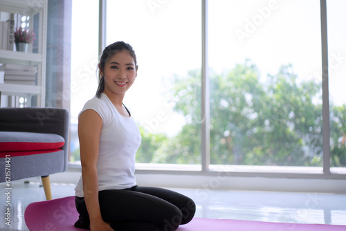 Free Download Women play yoga at home. Healthy lifestyle and friendship concept - GFXLoad