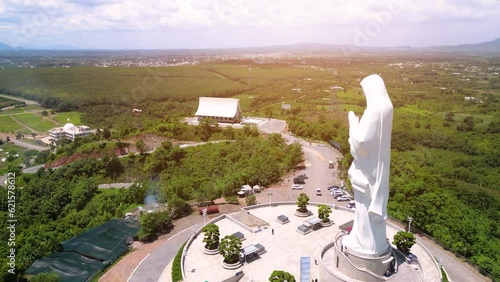 Aerial view of Our lady of Lourdes Virgin Mary catholic religious statue on a Nui Cui mountain in Dong Nai province, Vietnam. photo