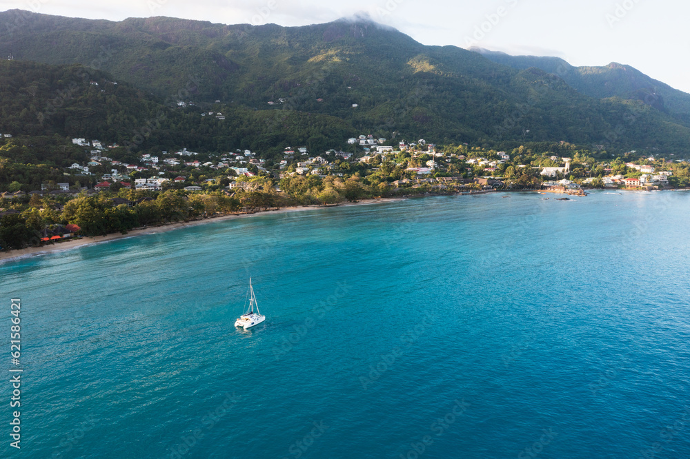 Beautiful seascape bay with luxury yacht at the coast of Beau Vallon, Indian Ocean, Seychelles Island.