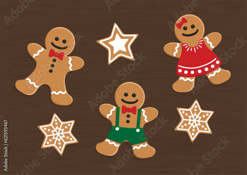 Top view vector illustration of gingerbread man, woman,  star and snowflakes (ID: 621593467)