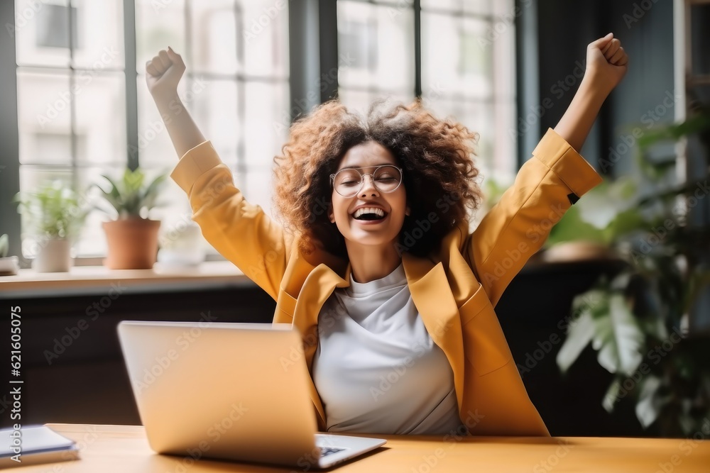 Joyful business woman freelancer entrepreneur smiling and rejoices in victory while sitting at desk after working finishing project at home, Freelancer, Gesturing with her hands rejoicing in victory. - obrazy, fototapety, plakaty 