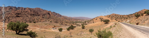 Great panoramic landscape of the Anti-Atlas mountains in the Taourirt region, a road winding through the mountains