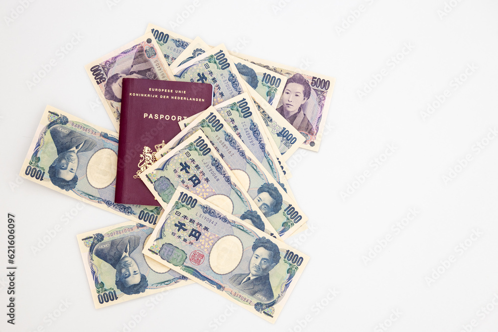 Dutch passport and Japanese yen in banknotes of 1000 and 5000