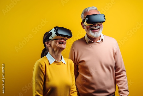 Senior mature couple having fun with virtual reality glasses. Old people using new headset goggles trends technology