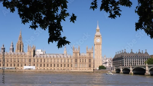 View of London, Houses of Parliament building with Big Ben. British history, Palace of Westminster, river bank. High quality 4k footage