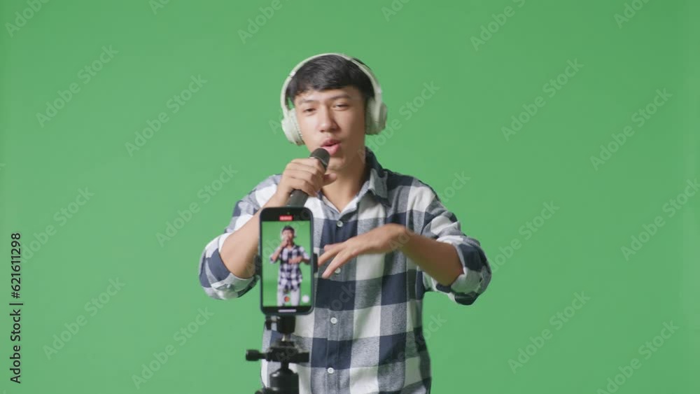 Smartphone Record Young Asian Teen Boy Holding A Microphone And Rapping ...