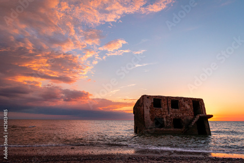 Fototapeta Naklejka Na Ścianę i Meble -  Beautiful and colorful sunset over the Northern forts in the Baltic sea coastline at Karosta (Liepaja, Latvia)