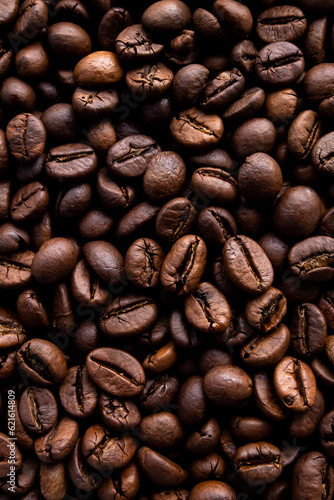 A close-up of roasted coffee beans can be used as a background for your coffee project