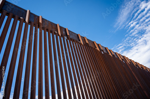 border wall and clouds