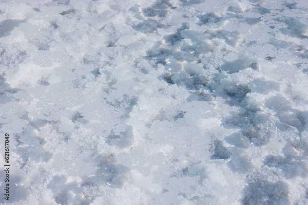 Close up of the salty water in the basins in the salt crust of the huge salt flats Salinas Grandes de Jujuy in northern Argentina while traveling South America