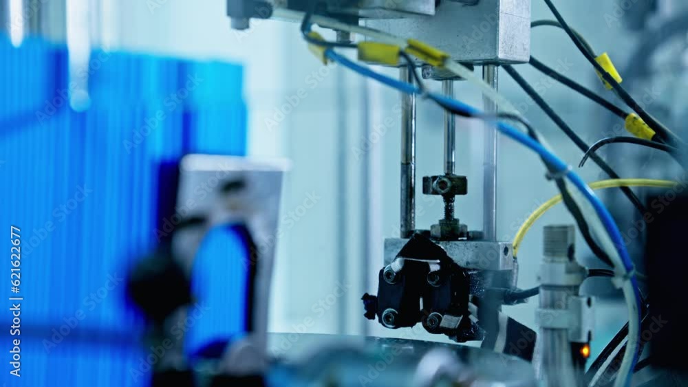 Factory machine at work. Production equipment at medical industry. Part of cytobrush, probe. 4K, UHD