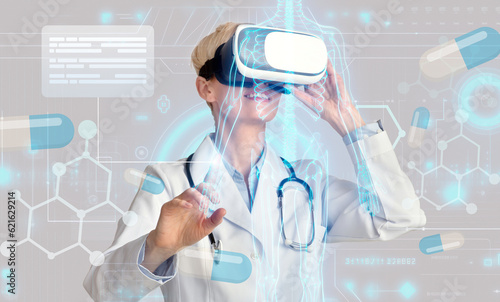 Woman doctor using VR goggles  touching hologram  study patient data