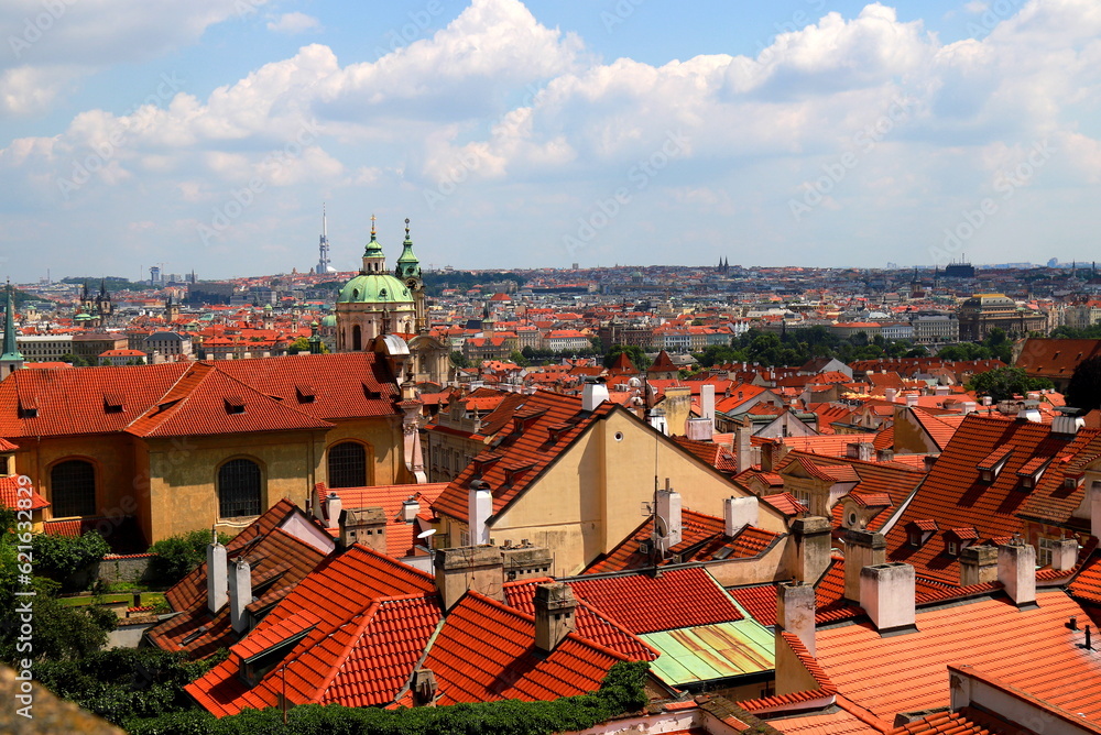 Obraz premium Prague, Czech Republic. Mala Strana of Prague. Top view of downtown, panorama. Ancient medieval buildings with red tiled roofs, church, tower, castle
