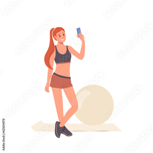 Young slim woman with perfect figure taking selfie shot by phone camera after training with fitball
