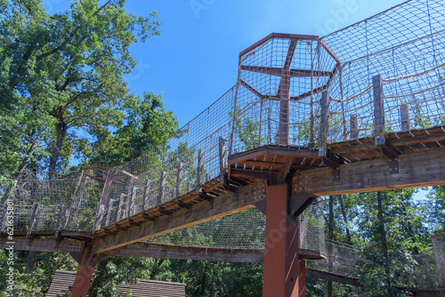 Fototapeta The paths in the zoo are fenced with a net.