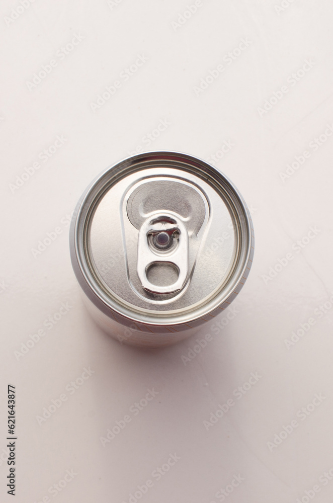 Closeup of silver soda can, top view, unlabeled.000- Shiny metallic texture and light reflections. Closeup of silver soda can, top view, unlabeled.000- Shiny metallic texture and light reflections.