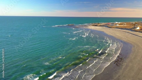 Aerial Shot Of Waves Splashing On Shore Against Sky, Drone Flying Backward Over Beach - Baja California, Mexico