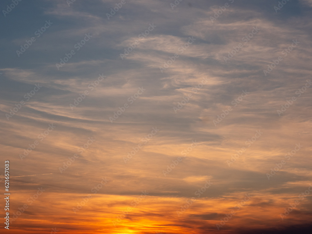 Amazing sunset sky. Warm and cool color. Calm and peaceful mood. Nature background for design or sky replacement.
