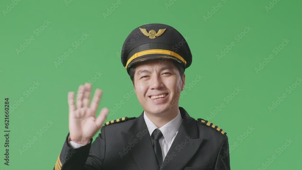 Close Up Of Asian Man Pilot Smiling, Waving Hand, And Saying Bye While Standing In The Green Screen Background Studio
Close Up Of Asian Man Pilot Smiling, Waving Hand, And Saying Bye While Standing In The Green Screen Background Studio