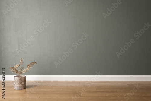 Foto Blank dark green wall in house with dry plant in wooden basket pot, baseboard on wooden parquet in sunlight for luxury interior design decoration, home appliance product background