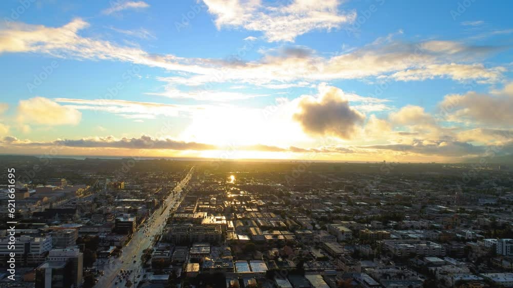 Aerial Panning Shot Of Cityscape Against Cloudy Sky At Sunset, Drone Flying Over Buildings In City - Culver City, California Aerial Panning Shot Of Cityscape Against Cloudy Sky At Sunset, Drone Flying Over Buildings In City - Culver City, California