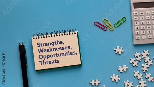 Obraz na płótnie There is notebook with the word strengths, weaknesses, opportunities, threats