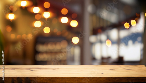 empty table to showcase your product, against the background of a blurred cafe golden bokeh © Uuganbayar
