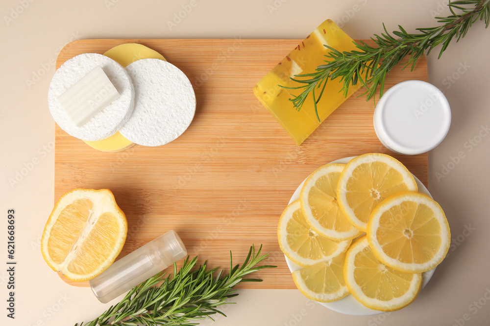 Lemon face cleanser. Fresh citrus fruits, rosemary and personal care products on beige background, flat lay Lemon face cleanser. Fresh citrus fruits, rosemary and personal care products on beige background, flat lay