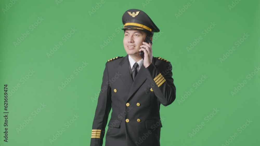 Asian Man Pilot Using Smartphone While Walking In The Green Screen Background Studio
Asian Man Pilot Using Smartphone While Walking In The Green Screen Background Studio