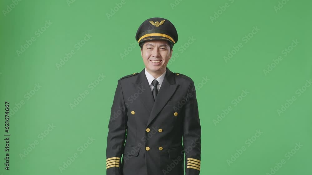 Front View Of Asian Man Pilot Standing And Smiling To Camera In The Green Screen Background Studio
Front View Of Asian Man Pilot Standing And Smiling To Camera In The Green Screen Background Studio