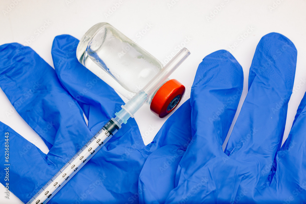 vaccine and vaccination concept 24 gauge syringe with red top vial vaccine and vaccination concept 24 gauge syringe with red top vial