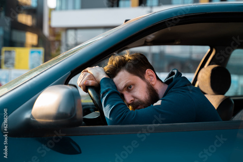 Fotografia, Obraz Desperate man behind the wheel, car crash or problems with the car