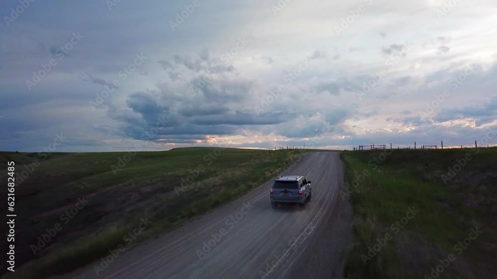 Aerial Shot Of Car Moving On Mountain Road Against Sky At Sunset - Billings, Montana Aerial Shot Of Car Moving On Mountain Road Against Sky At Sunset - Billings, Montana