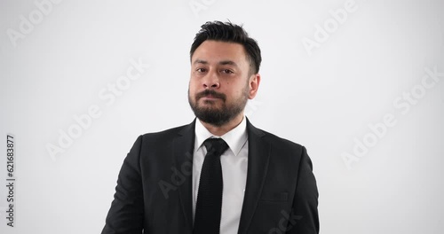 The depiction of a middle-aged businessman exhibiting an irritable demeanor in a studio environment through close-up shots, expressing his frustration through body language