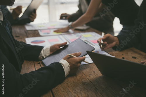 Group of business people doing bookkeeping, colleagues discussing, start planning, sharing ideas, working together in modern office. Meeting Teamwork successful business job interview ideas
