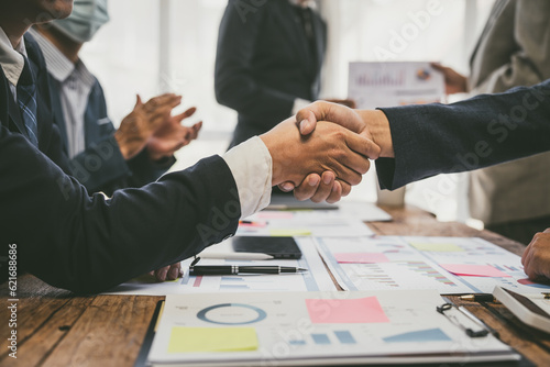 Shaking hands, Group of business people doing bookkeeping, colleagues discussing, start planning, sharing ideas, working together in modern office. Meeting Teamwork successful job interview ideas