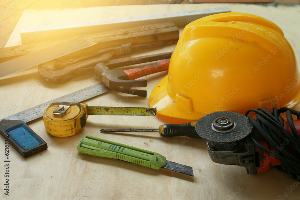 Various hand tools are placed on the wooden floor. Various hand tools are placed on the wooden floor.