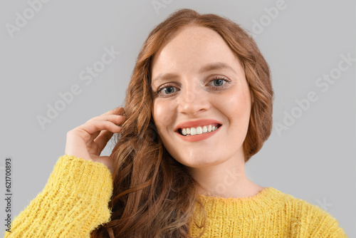 Beautiful woman with red ha...