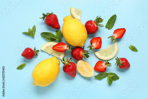 Fototapeta Naklejka Na Ścianę i Meble -  Ingredients for preparing strawberry lemonade on blue background