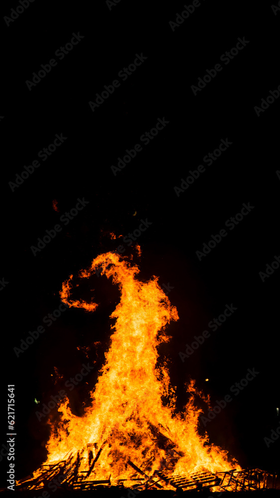 big bonfire on the beach at night with beautiful forms on the flames big bonfire on the beach at night with beautiful forms on the flames