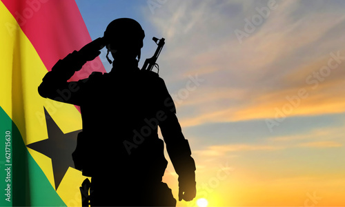 Silhouette of a soldier with Ghana flag against the sunset. EPS10 vector