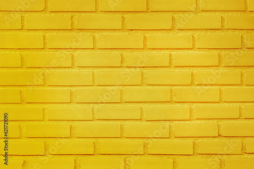 Yellow brick wall texture with vintage style pattern for background and design art work.