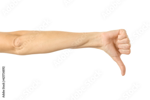 Thumb down. Woman hand gesturing isolated on white © Iurii