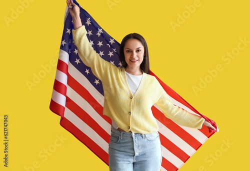 Happy young woman with USA ...