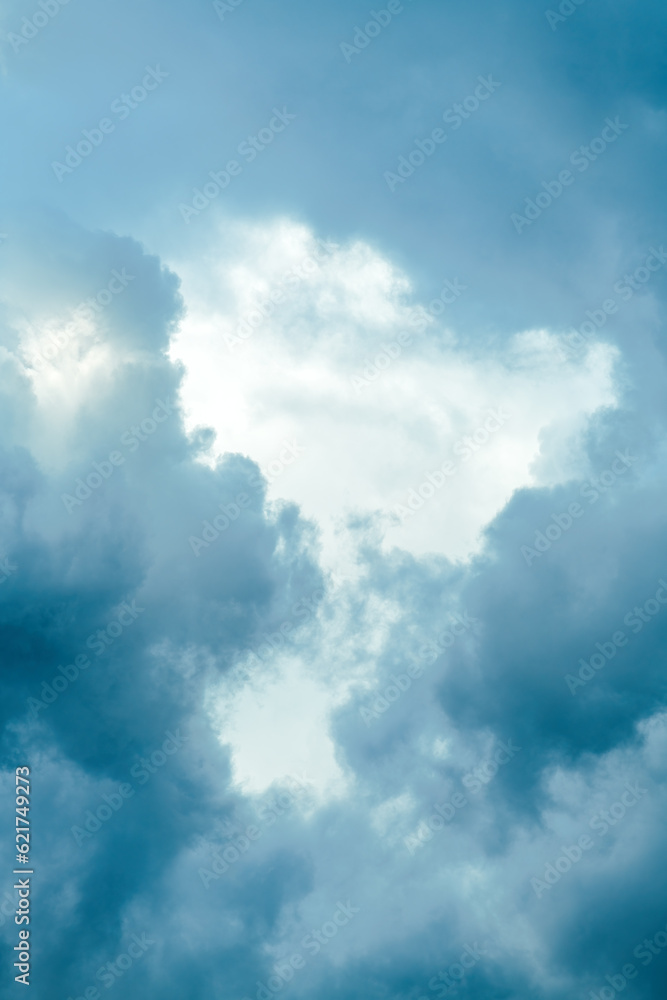Vertical shot of moody sky with dramatic clouds in spring, weather forecast and climate change background