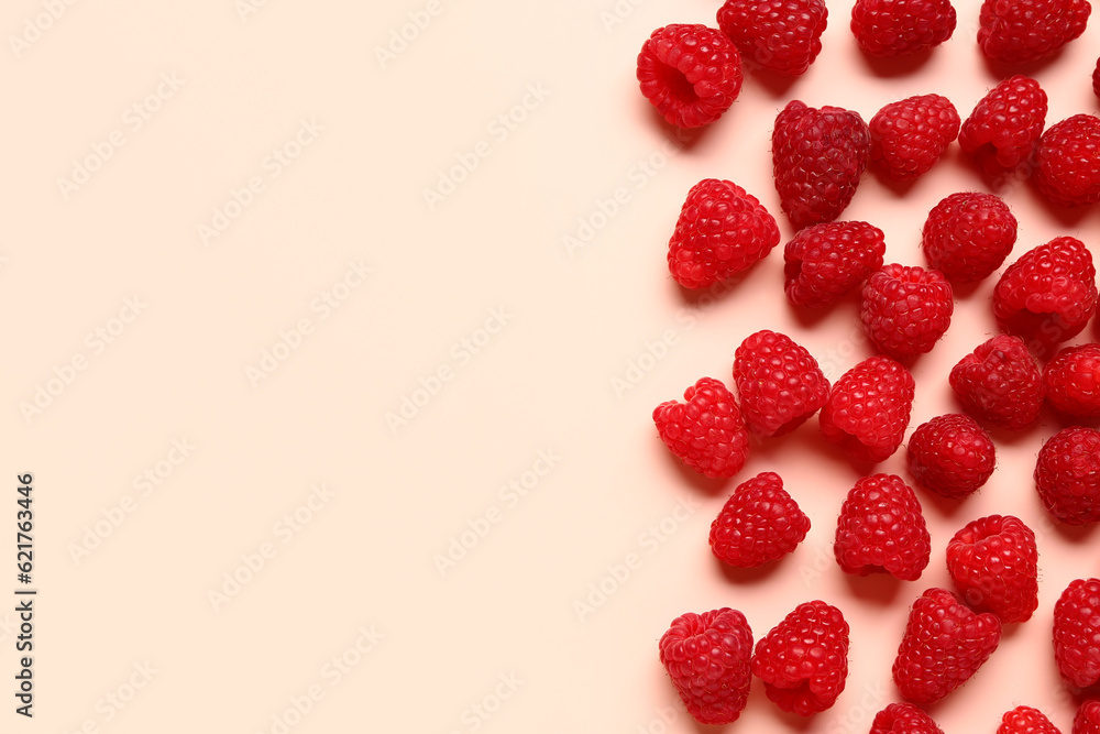 Many fresh raspberries on pink background