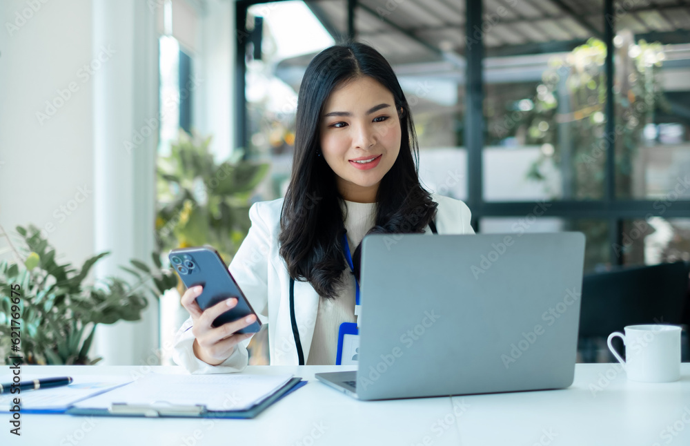 businesswomen sit at their desks and calculate financial graphs showing results about their investments, planning successful business growth processes in the office