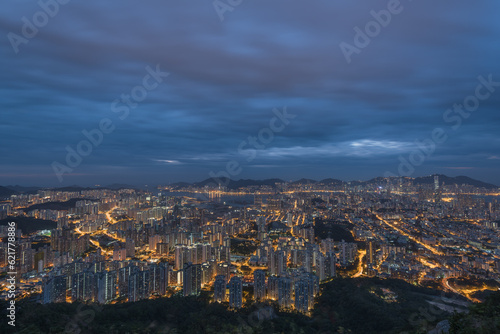 Aerial City Night view of Hong Kong City with sky and building and street © Nick