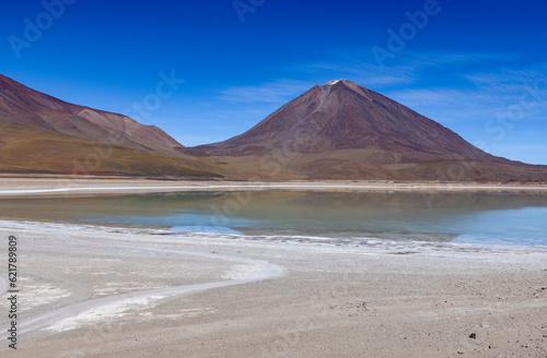 Picturesque Laguna Verde with Licancabur Volcano, just one natural sight while traveling the scenic lagoon route through the Bolivian Altiplano